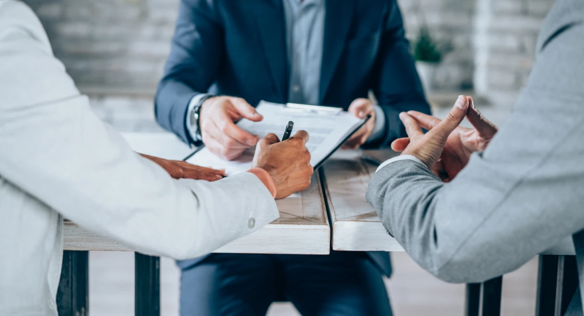 Business meeting with documents on table