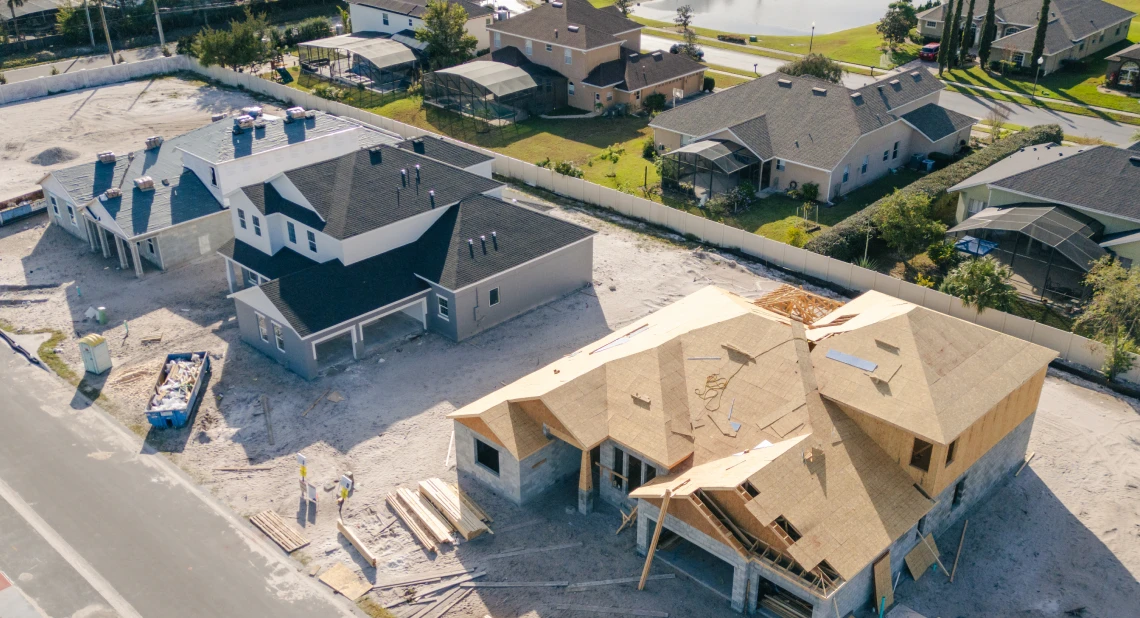 Suburban neighborhood with unfinished houses